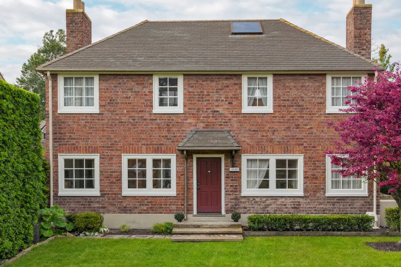 Handsome new windows lifting the kerb appeal of a brick townhouse