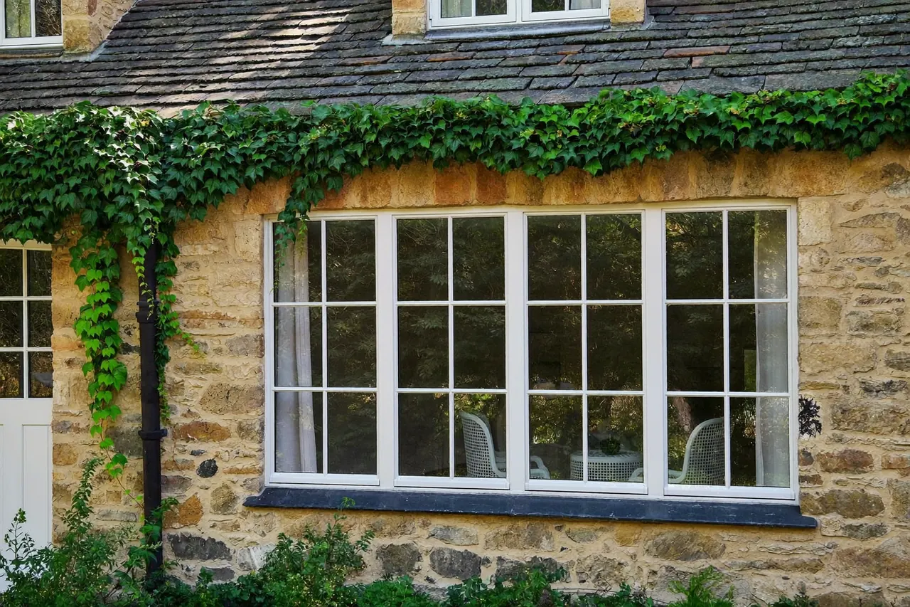 Timber sash windows on a stone country cottage