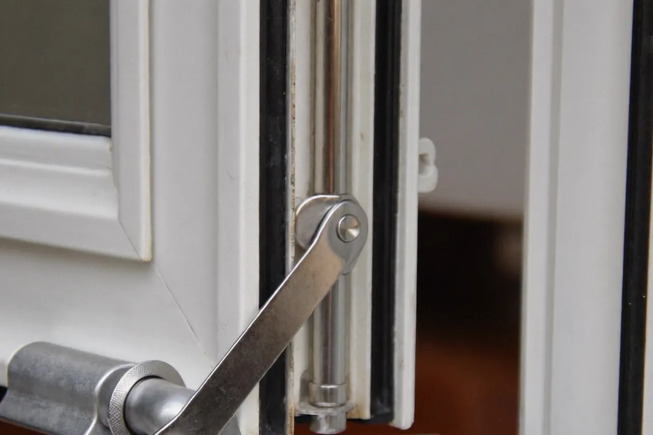 Close-up of a trickle vent and drainage slot on a window frame